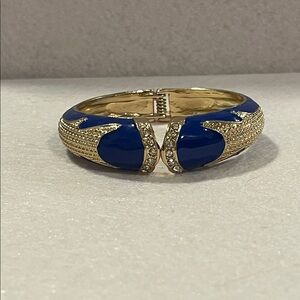AMRITA SINGH Gold Tone, Crystals, Blue Enamel Graduated Hinged Clamper Bracelet.